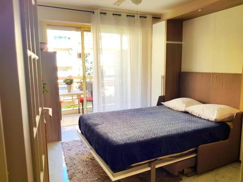 En eller flere senge i et værelse på L'Azur Promenade