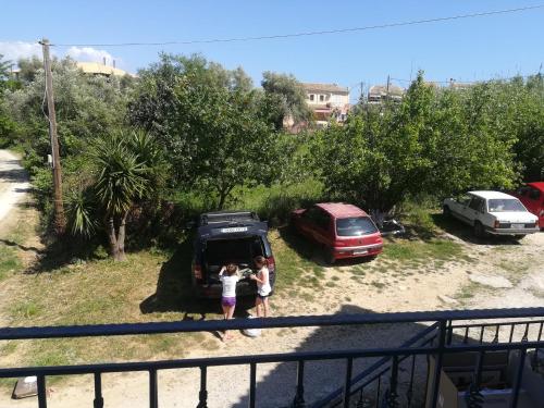 two people standing in front of a van at Katerina's appartement in Nikiana