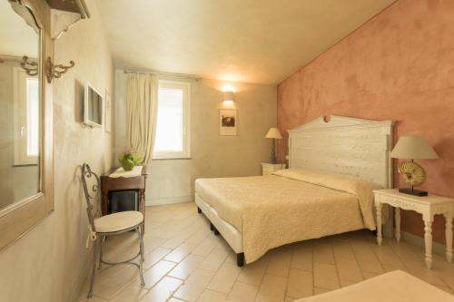 Katil atau katil-katil dalam bilik di Il Cortiletto Hotel Maison