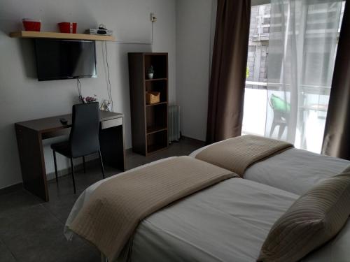 Postel nebo postele na pokoji v ubytování Apartamentos El Patio