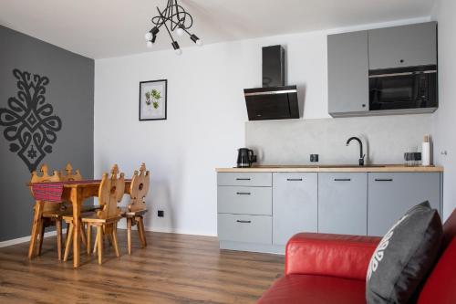 Kuchyň nebo kuchyňský kout v ubytování 5 Wierchów Apartamenty