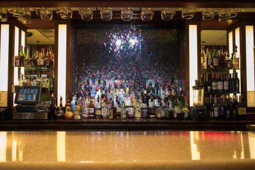 a bar with a lot of bottles of alcohol at Mineral Palace Hotel & Gaming in Deadwood