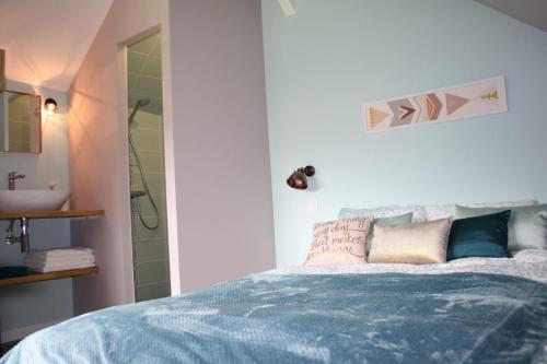 Ένα ή περισσότερα κρεβάτια σε δωμάτιο στο le petit boudoir