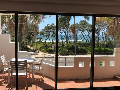 a view of the ocean from the balcony of a house at Camargue Beachfront Apartments in Maroochydore