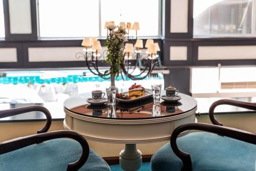 a table with a plate of food on it at Viva Deluxe Hotel in Istanbul