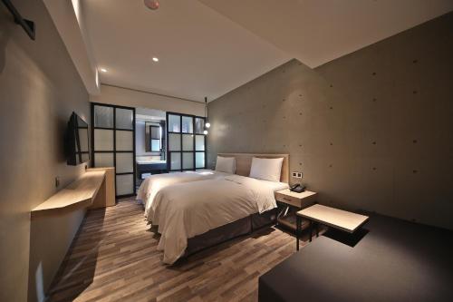 מיטה או מיטות בחדר ב-Fengjia Micro Hotel