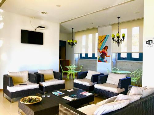 a living room with a couch and a table at HI Vila Nova de Cerveira - Pousada de Juventude in Vila Nova de Cerveira