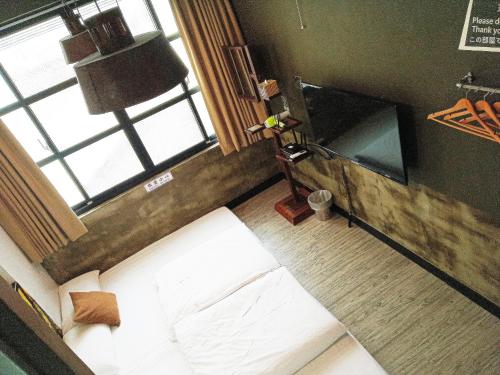 TV a/nebo společenská místnost v ubytování Tainan House