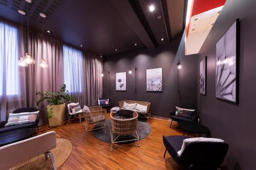 a waiting room with chairs and a table at Ibis Praha Old Town in Prague