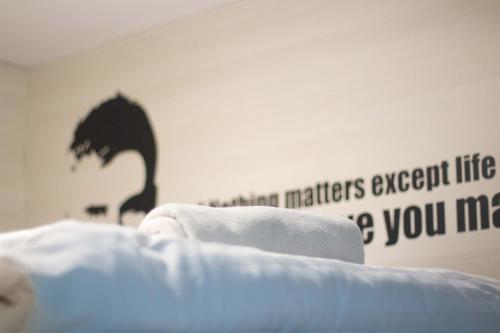 Postel nebo postele na pokoji v ubytování Sleep Walker Poshtel
