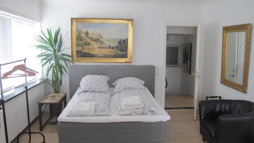 Llit o llits en una habitació de Guesthouse Sharon Apartments