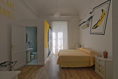 Un ou plusieurs lits dans un hébergement de l'établissement Afea Art & Rooms
