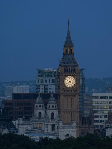 a large building with a clock tower on it at Four Seasons Hotel London at Park Lane in London