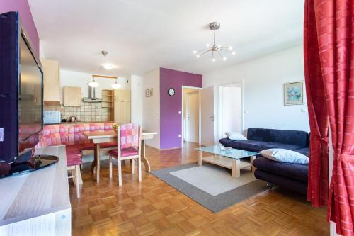 a living room with a couch and a table at Couples Getaway in Bohinj