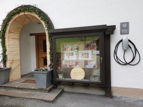 a store window with a phone on the side of a building at Apartment Reiter in Zellbergeben