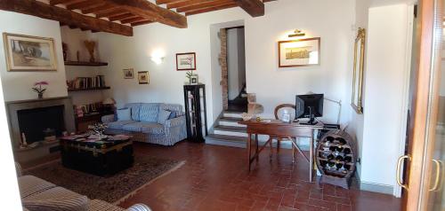 a living room with a couch and a table at Torrebianca Tuscany in Rignano sullʼArno