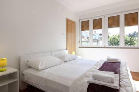 Posteľ alebo postele v izbe v ubytovaní Nina, apartment in city centre