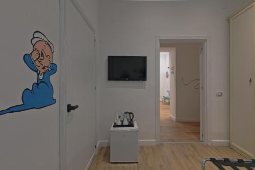 TV a/nebo společenská místnost v ubytování Afea Art & Rooms