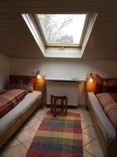 Postel nebo postele na pokoji v ubytování Ferienwohnungen In de goldisch Luft