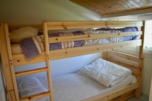 a couple of bunk beds in a room at Maison de campagne pour 6 in Commequiers