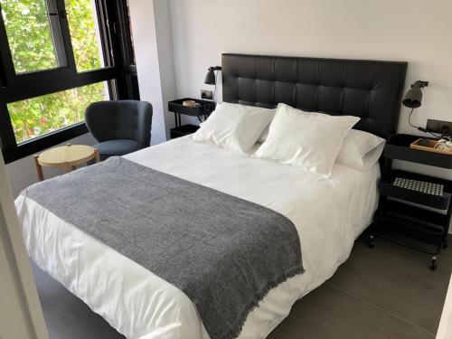 Ένα ή περισσότερα κρεβάτια σε δωμάτιο στο Apartamentos Kronox