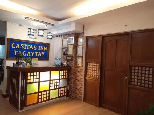 a room with a door and a sign on the wall at Casitas Inn Tagaytay Co. in Tagaytay