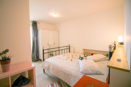 a bedroom with a bed with flowers on it at Apartments Apartim Piran in Piran
