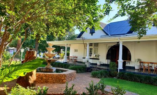 Κήπος έξω από το Bauhenia Guesthouse