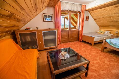 a living room with a tv and a couch at Holiday Home Mirt with HotTub & Sauna in Blanca