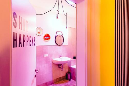 a bathroom with a sink and a white sink at PEPPIS LOFT in Merano