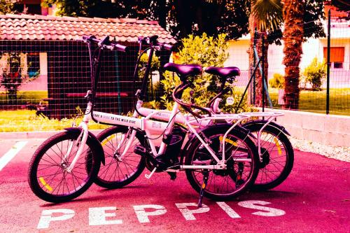 a pink bike parked in a parking lot at PEPPIS LOFT in Merano