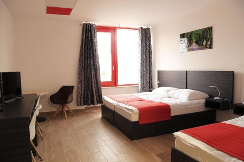 Postel nebo postele na pokoji v ubytování TOP HOTEL