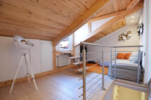a loft bedroom with a bunk bed and a desk at Home Venice Apartments - Biennale 1 - 2 - 3 in Venice