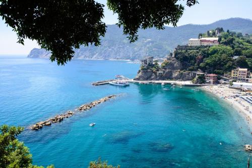 a view of a beach with blue water at Bellambra in Monterosso al Mare