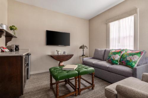a living room with a couch and a chair at The Glidden House in Cleveland