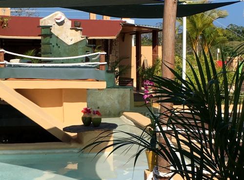 a house with a swimming pool next to a house at Cabrera Chalet boutique hotel in Cabrera