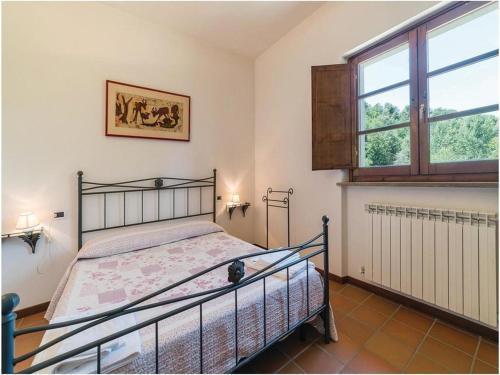 Tempat tidur dalam kamar di Ville Fontanelle Bettona