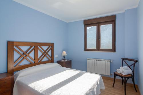 A bed or beds in a room at La Resplenda