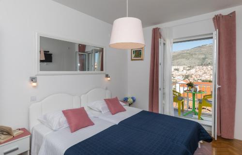 Postel nebo postele na pokoji v ubytování Apartments Lile