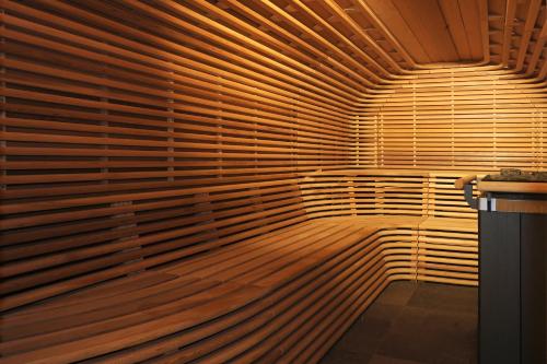 a room with a large wall of wooden blinds at 5 Terres Hotel & Spa - MGallery Collection in Barr