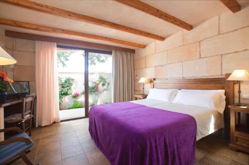 A bed or beds in a room at Sa Carrotja - Adults Only