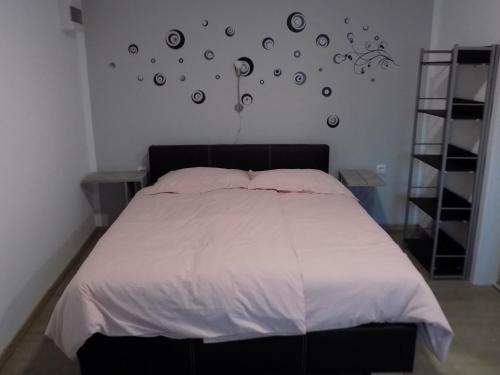 Кровать или кровати в номере Apartment Pri Ruscu