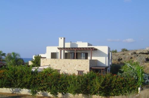 a white house on top of a hill at Villa Elena in Argaka in Argaka