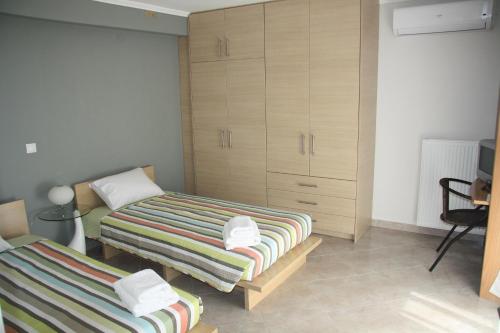 Ένα ή περισσότερα κρεβάτια σε δωμάτιο στο Thalatta Seaside Accommodation