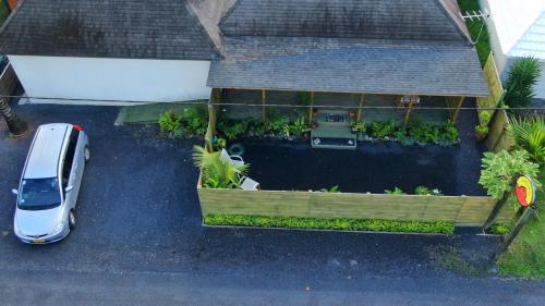 an aerial view of a backyard with a garden at ShineAwayHomes - Mountain View AIR CONDITIONED in Rarotonga