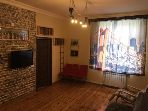 TV a/nebo společenská místnost v ubytování Al CAPONE LOFT