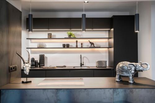 a kitchen with a counter with an elephant on it at AVA Apartments by Heimaleiga in Reykjavík