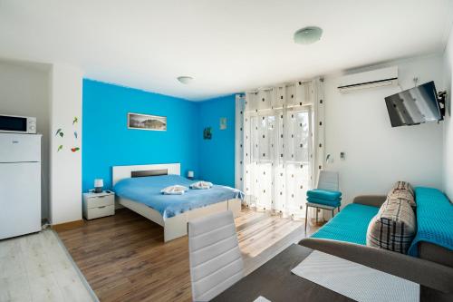 Кровать или кровати в номере Apartments Viktoria