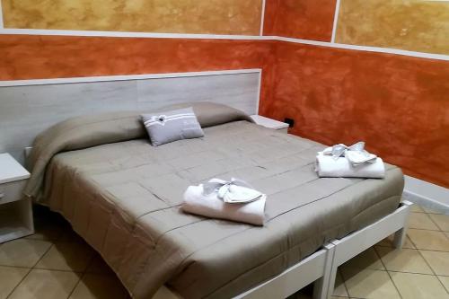 Posteľ alebo postele v izbe v ubytovaní A casa da Mimì&Cocò