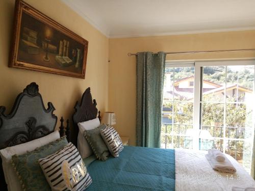 Кровать или кровати в номере Casa de Santo Amaro